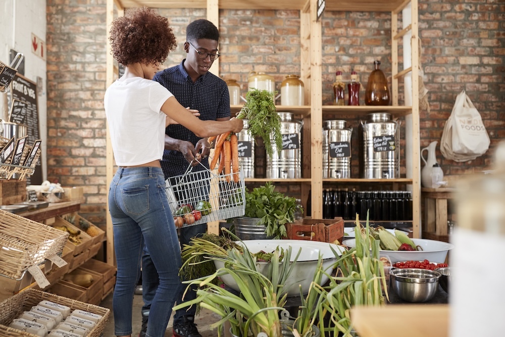 Couple buying produce at a Zero waste grocery store
