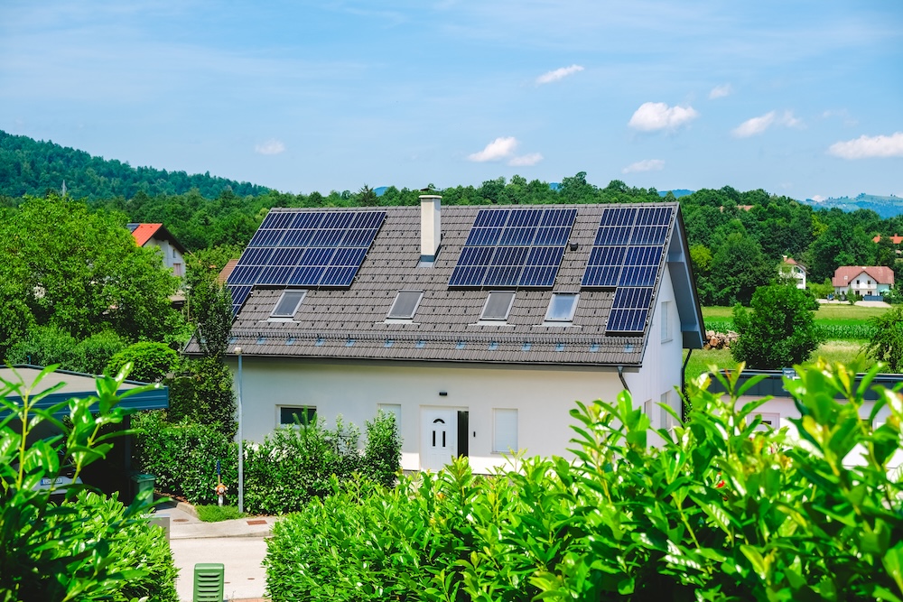 solar panels installed on roof of small family home