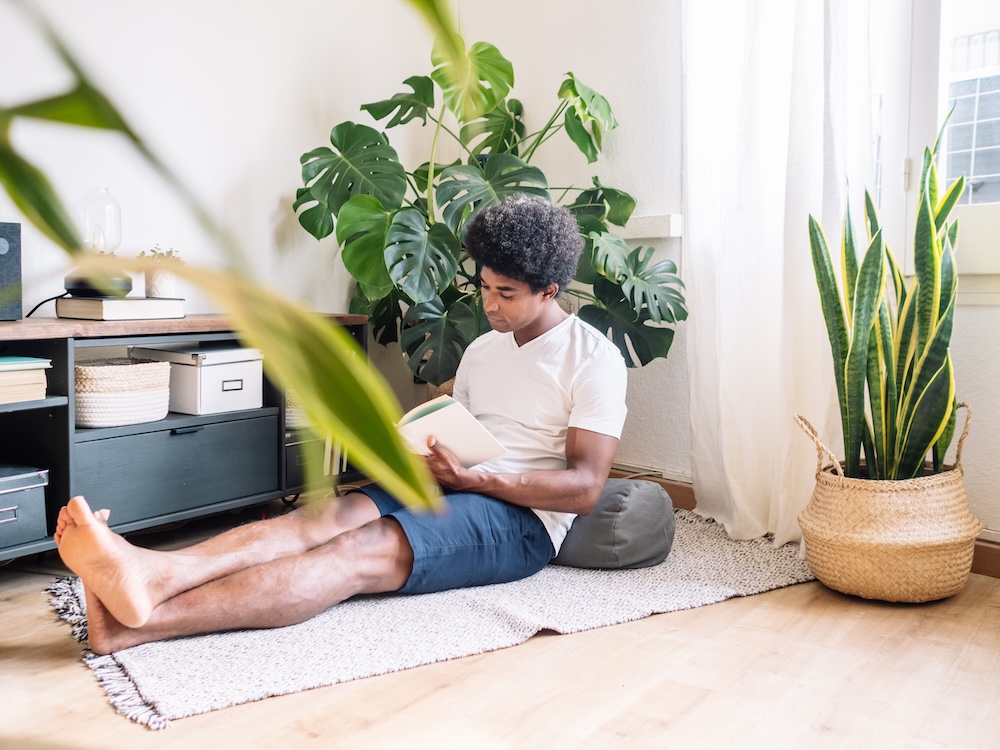 Young man sitting quietly reading a book in peace