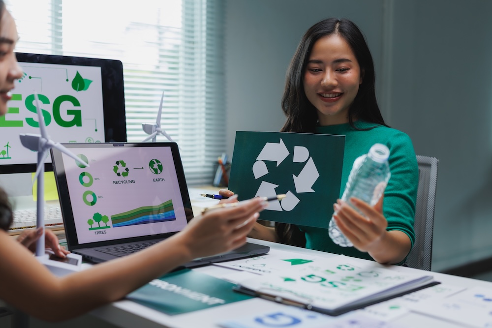 Business women discussing recycling policies