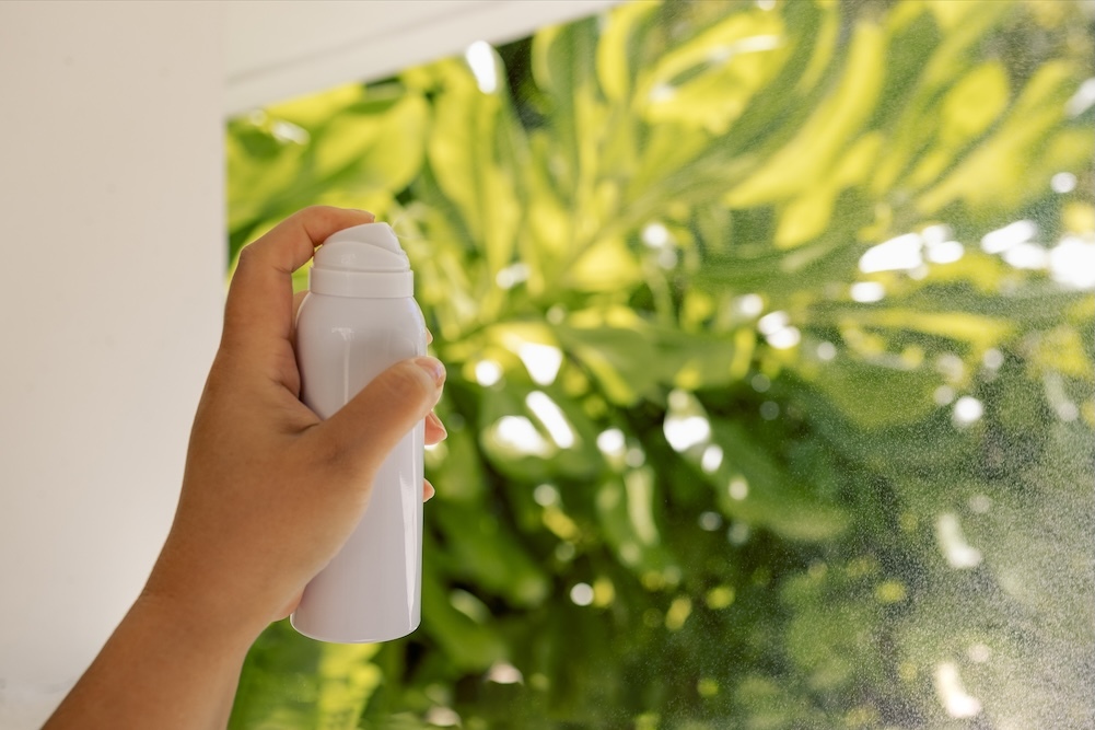 Hand spraying air freshener