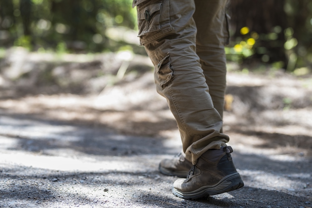 Person walking on street wearing cargo pants
