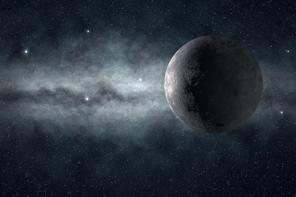 moon and the milky way glowing in the darkness