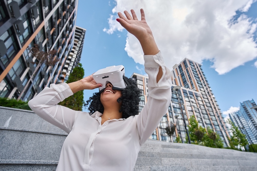 Young woman outside using Virtual Reality fear