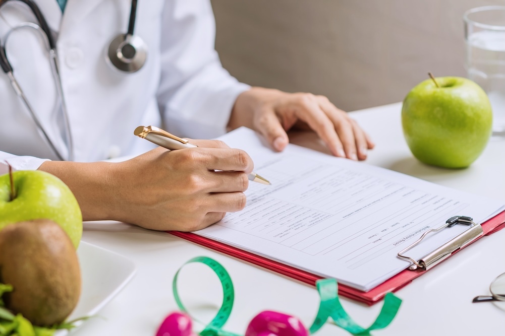 doctor writing up nutrition plan