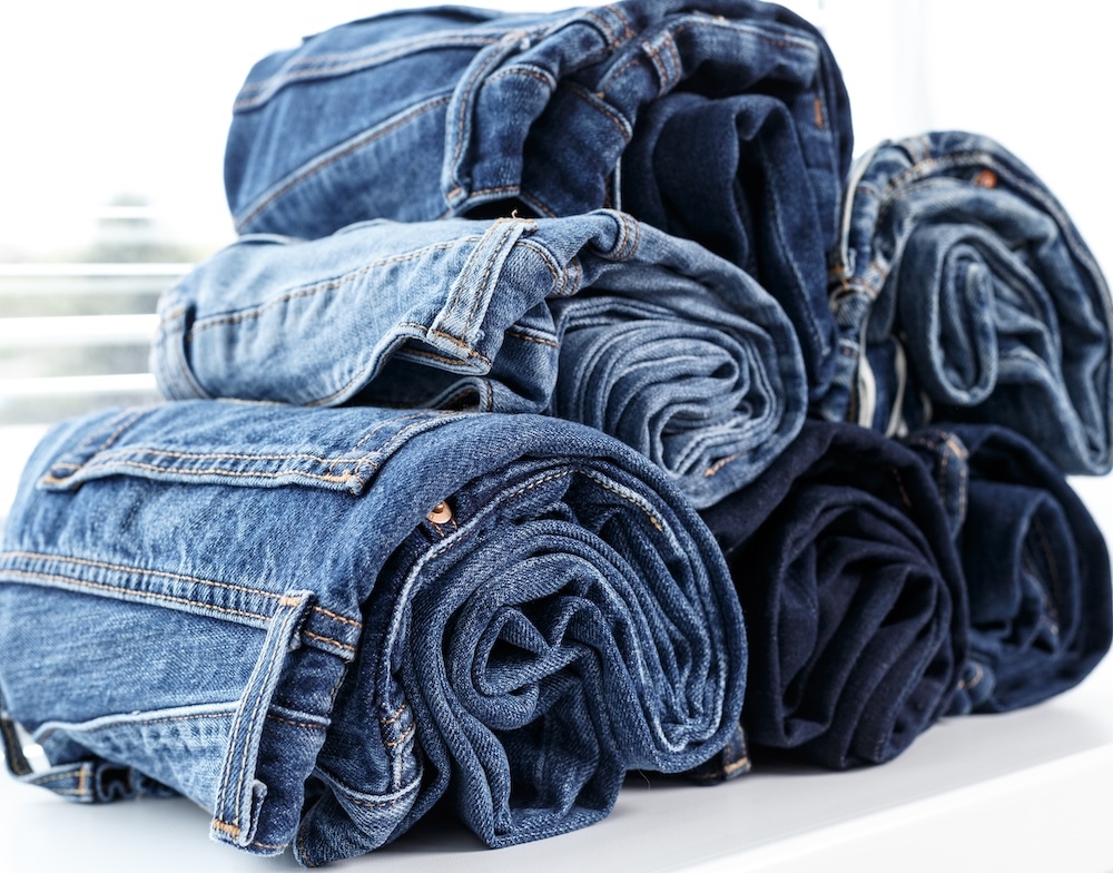 Rolled up stack of torn jeans