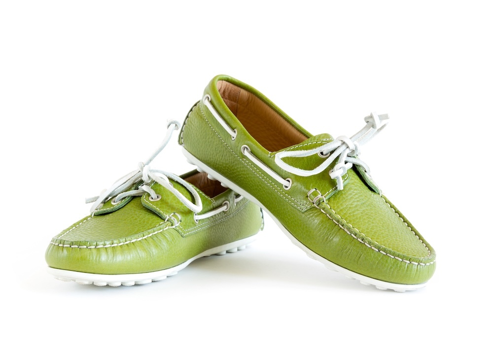 Green boat shoes with white laces