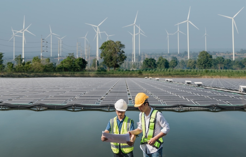 Service engineers checking solar cell production