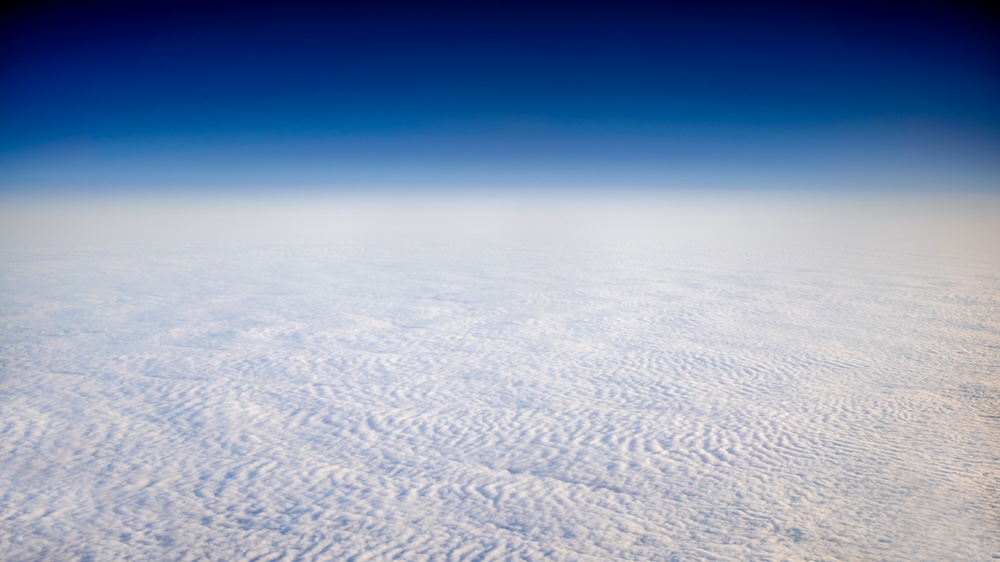 Blue sky above a cloudscape