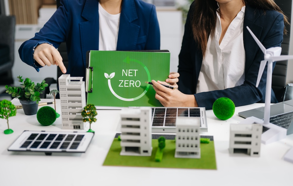 Colleagues discussing net-zero impact in business