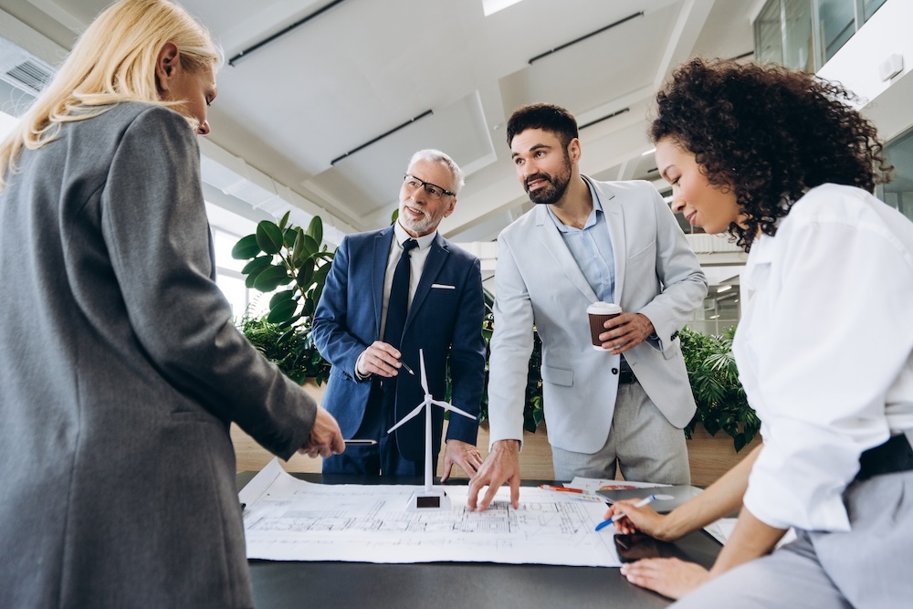Business people designing a blueprint for a sustainable business