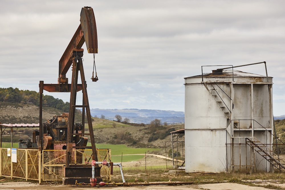 rusty oil pumping machine fracking petroleum