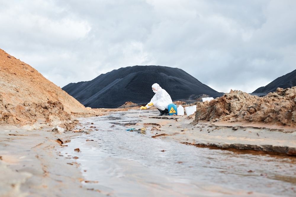 Scientist taking sample of water contamination