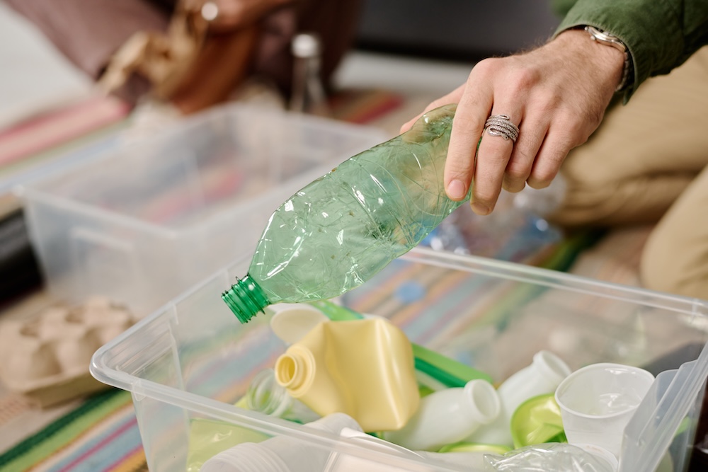 sorting through plastics for recylcing