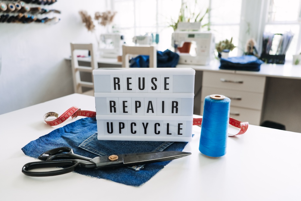 sign that says reuse repair upcycle