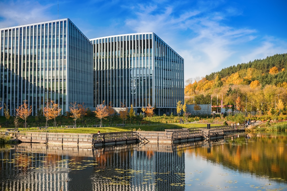 office building campus surrounded by man made river