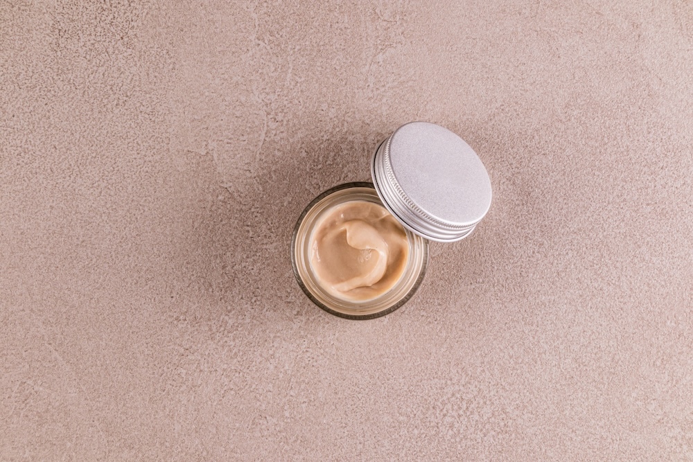 glass cosmetic jar with creamy blur balm