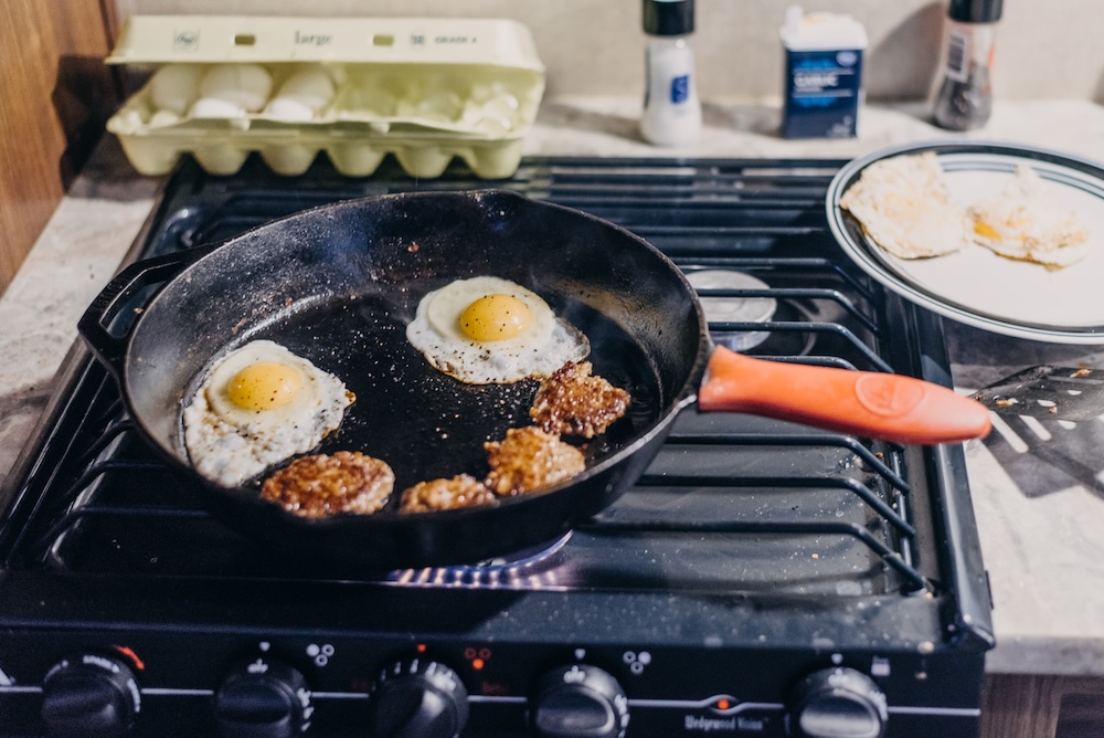breakfast made in a pan on a stove top