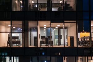 office building with empty offices and lights on