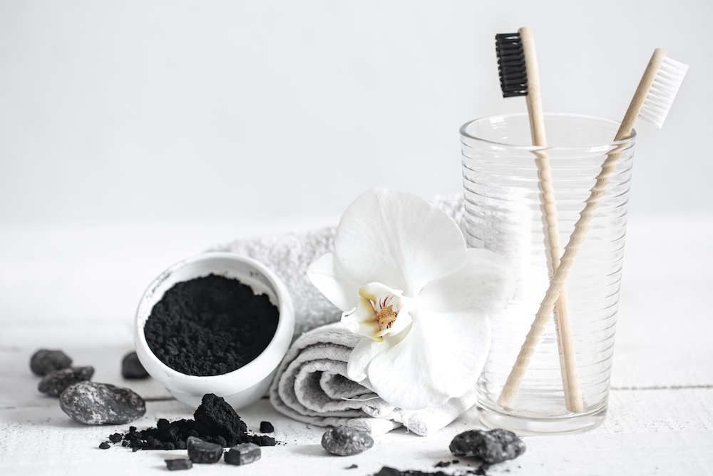 natural charcoal teeth cleaning solution on a table