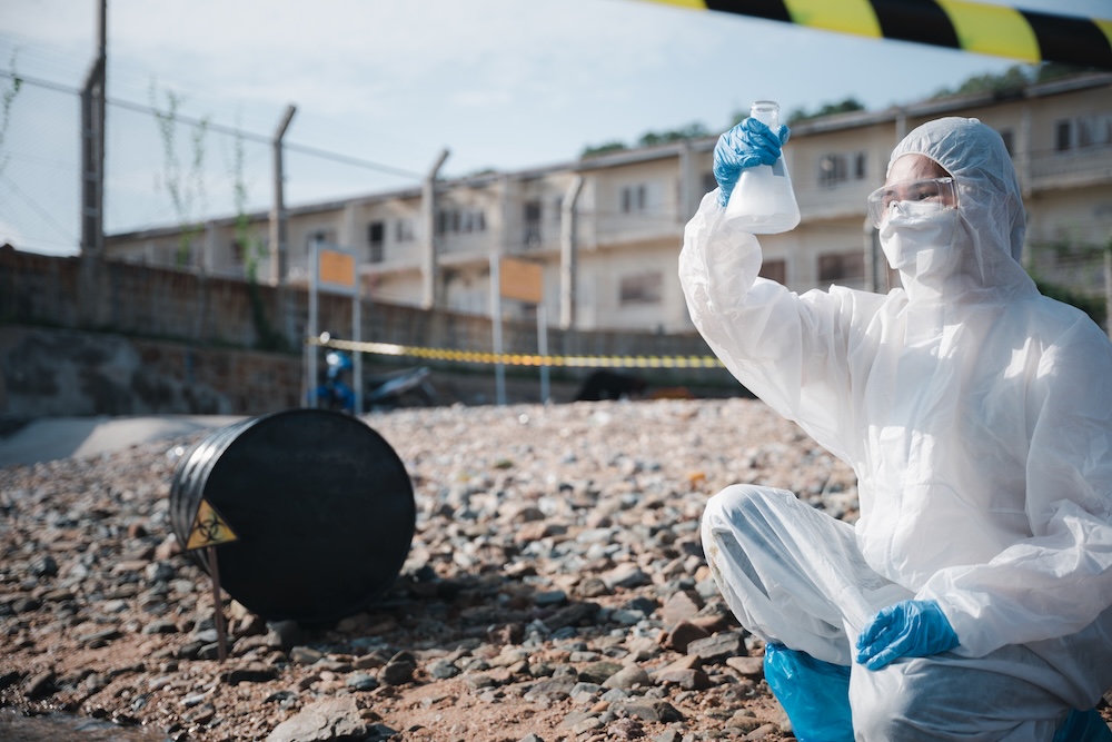 ecologist taking samples of toxix chemicals