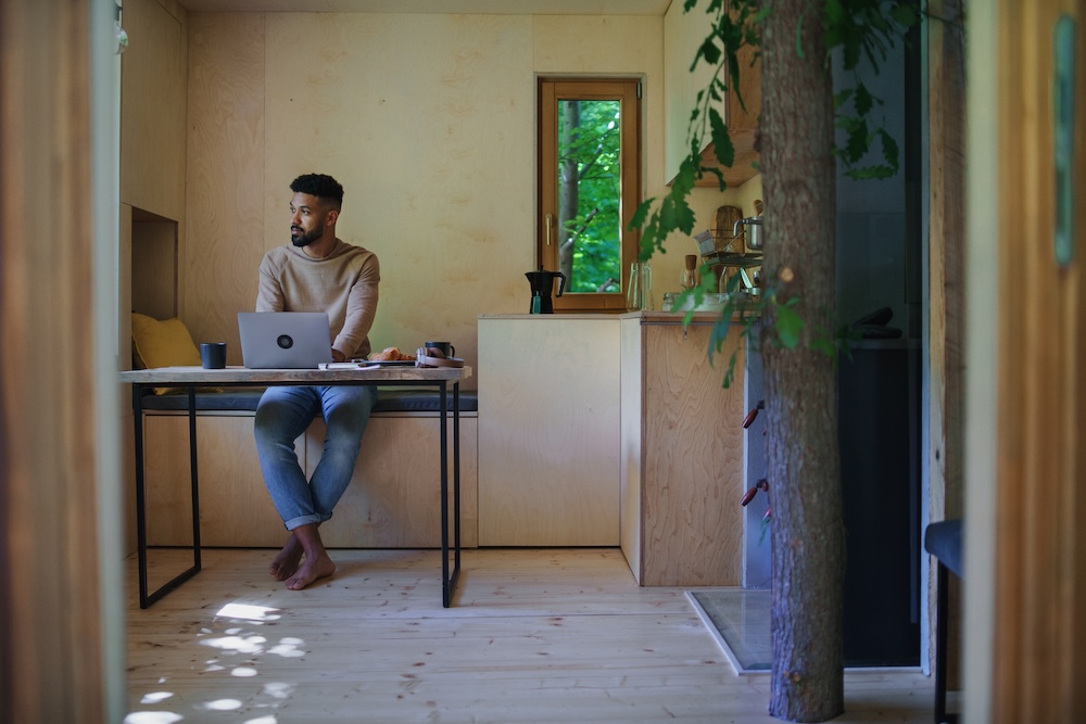 young businessman working at his laptop from his home office