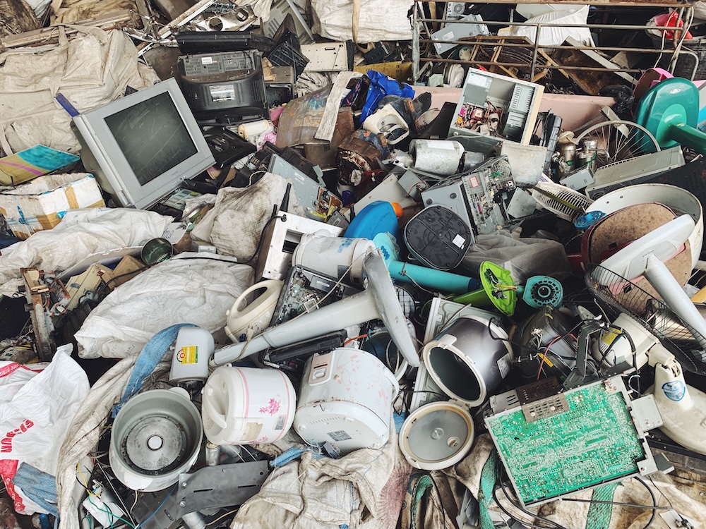 pile of electronics at an e-waste center