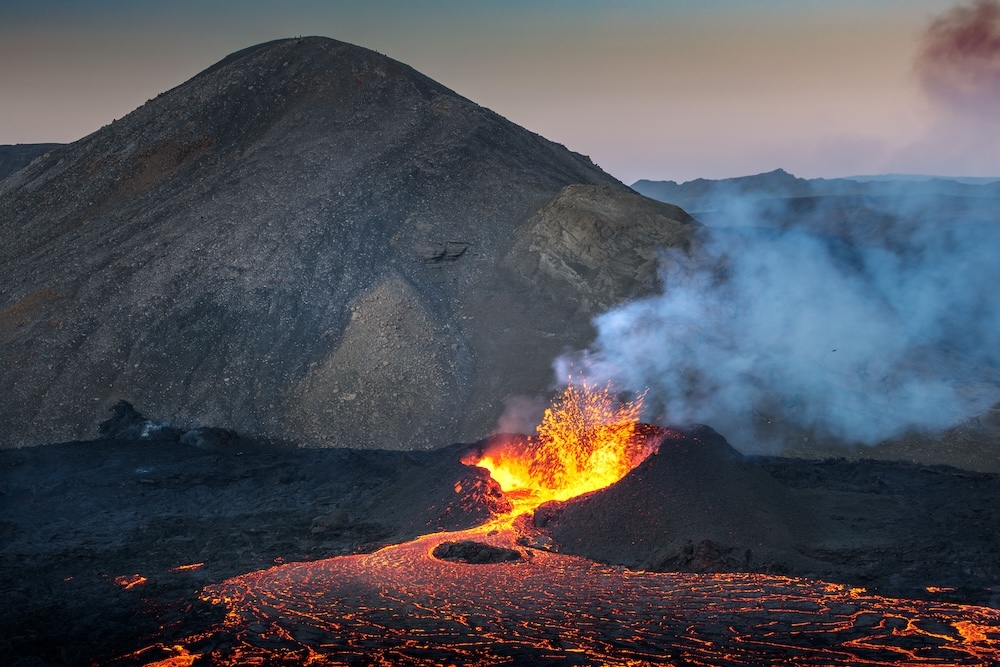 volcanic activity creating a stream of lava