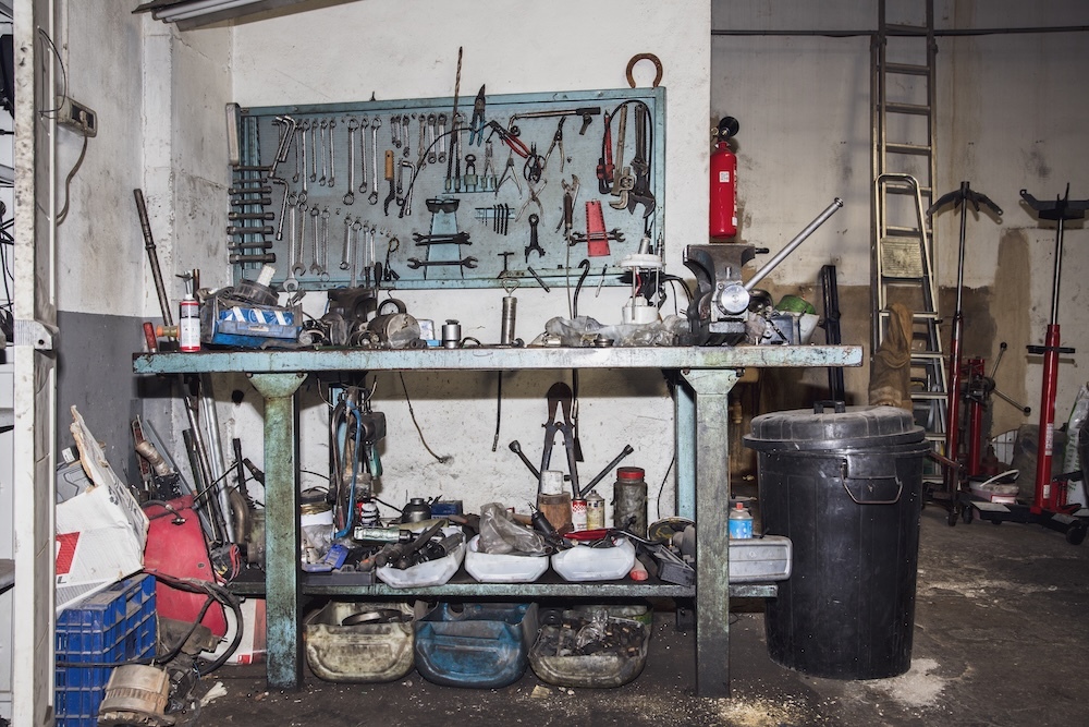 messy garage with lots of tools and clutter