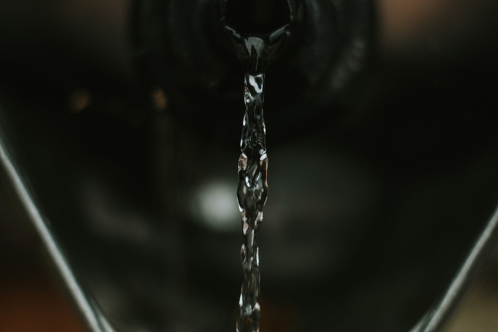 pouring water out of a large container