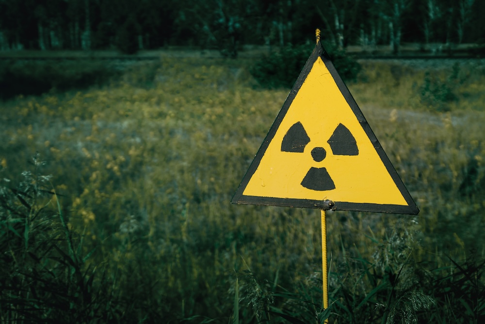 sign with a radiation symbol in the forest
