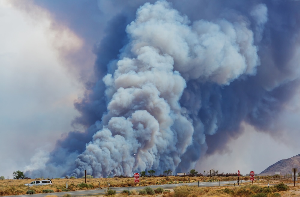 wildfire releasing smoke into the atmosphere