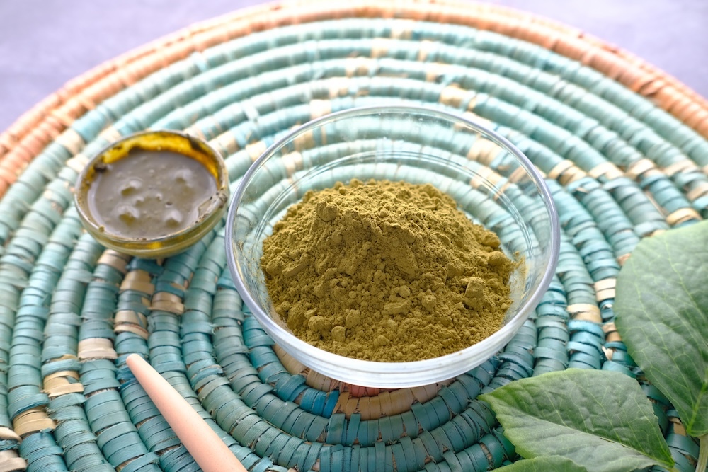 henna powder in a bowl on the table