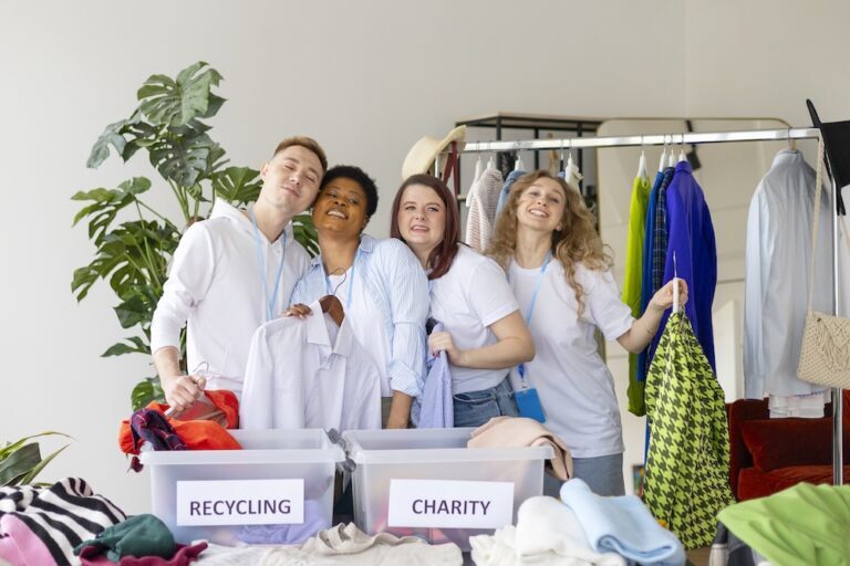 young people donating and recycling clothing in containers