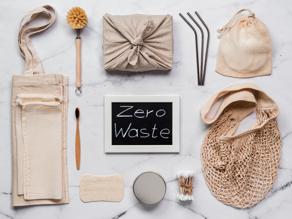 zero waste items on a table with a sign that says zero waste