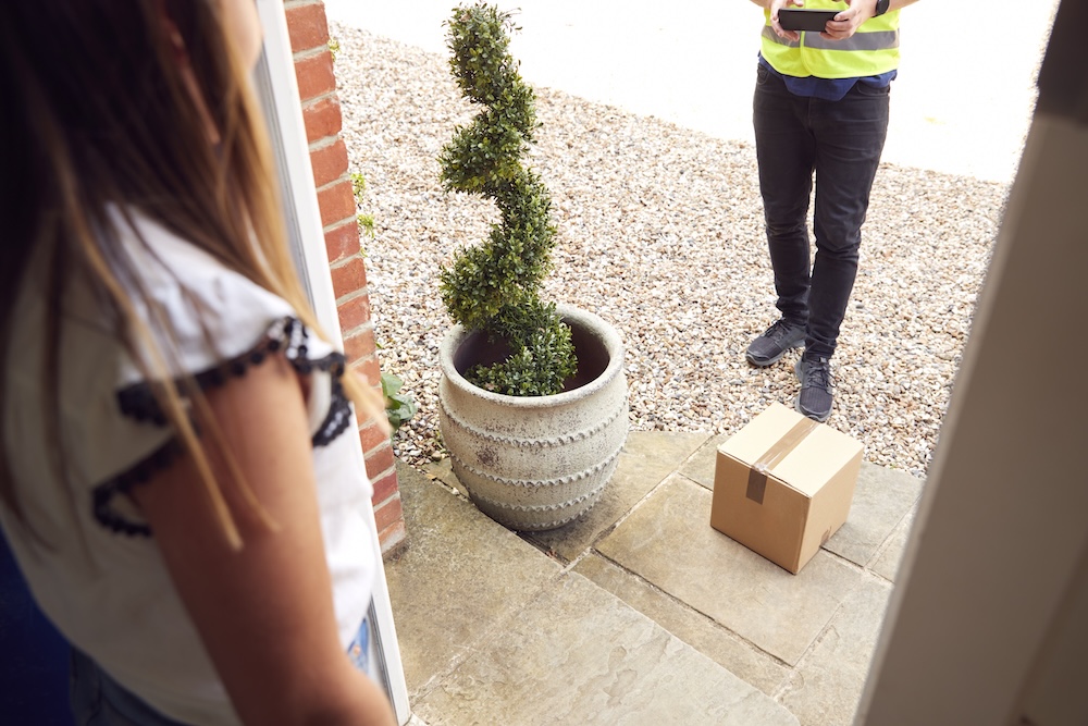 delivery driver leaving package at front door