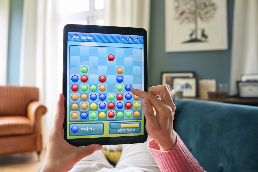 person playing a game on a tablet