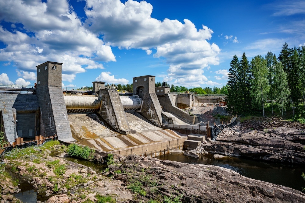 hydroelectric power station dam with blue sky and clouds