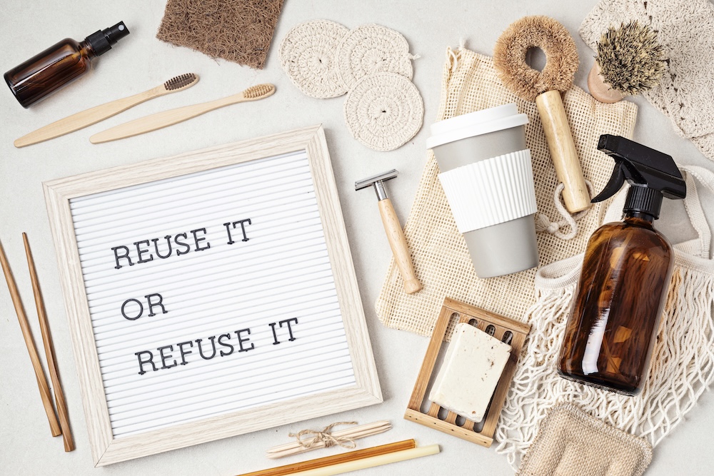 reuse it or refuse it on a letter box with eco-friendly products around