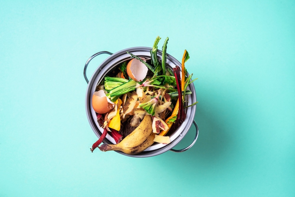 Scraps in a metal compost bin