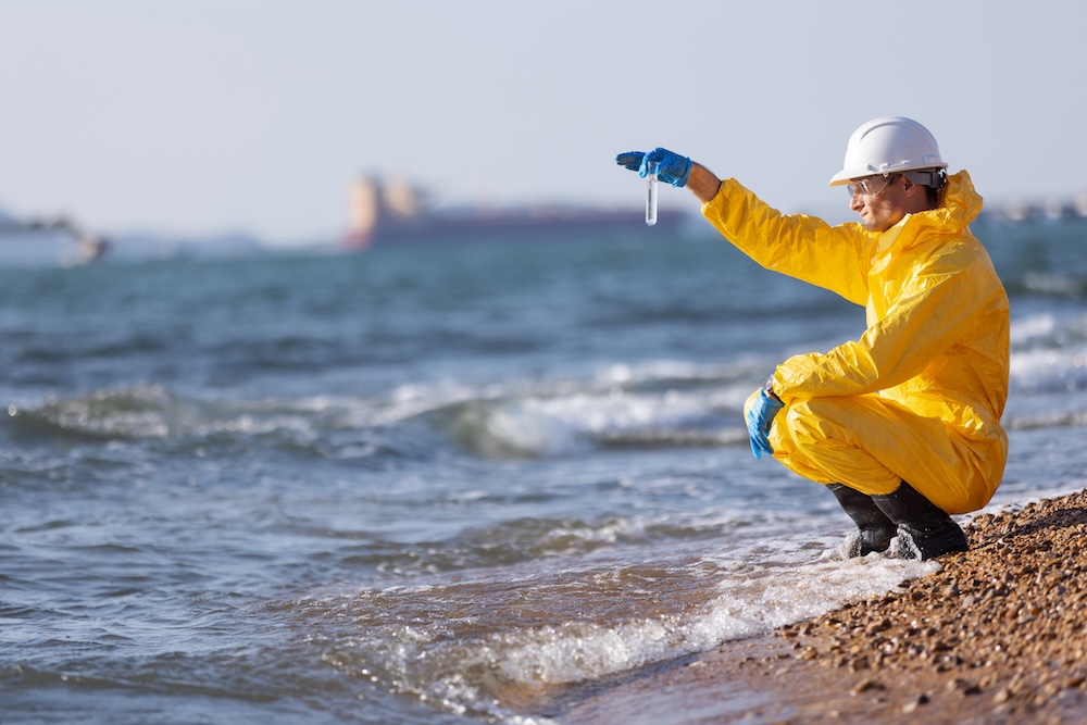 Scientist testing coastal water for contamination