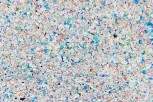 Shredded plastic formed into a board