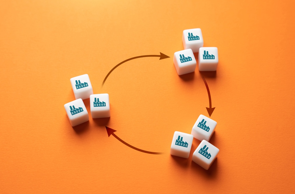 Arrows forming a circle pointing to industry blocks