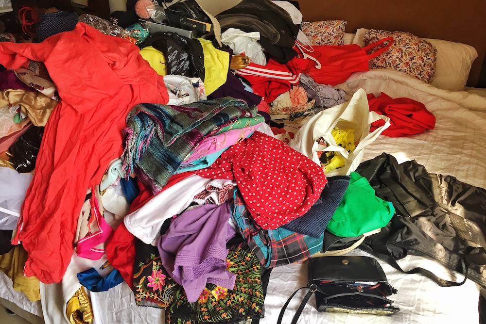 Spring cleaning clothes from closet to bed