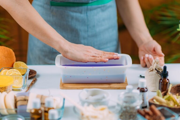 woman putting hand over warm paraffin wax