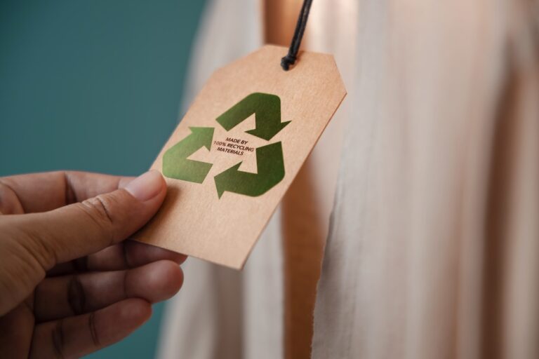 Label on shirt with recycled materials symbol