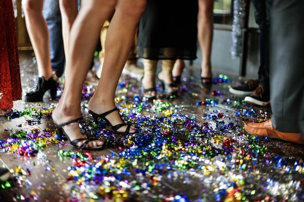 People stepping on plastic waste for celebration