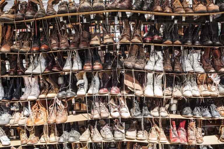 Rows of used boots on shelves