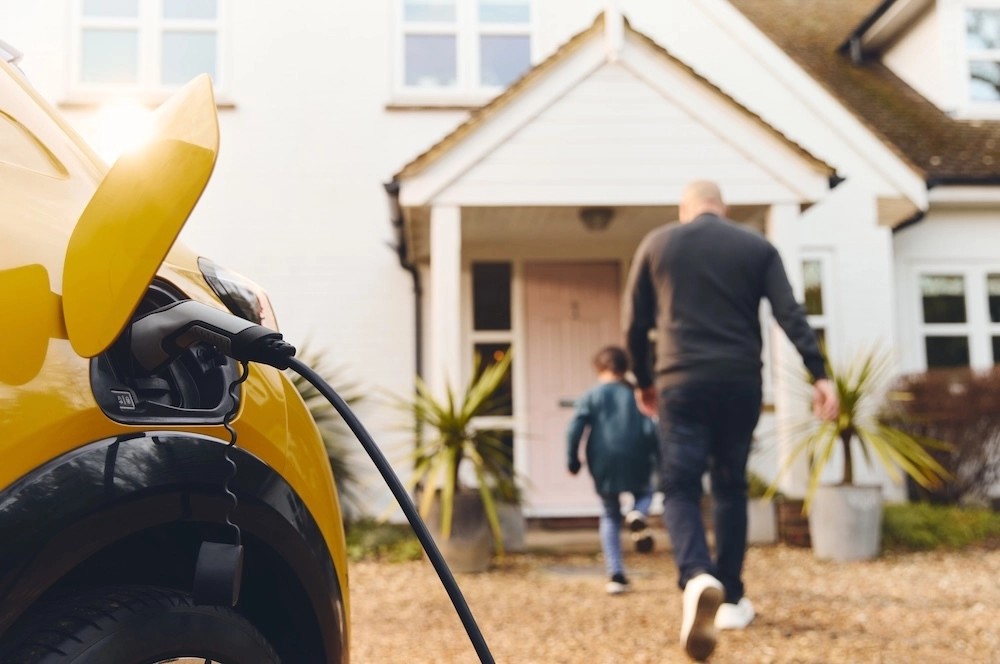 Electric vehicle charging in front of a home