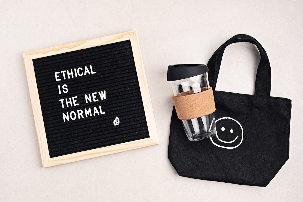 Sign that says ethical is new normal with reusable items